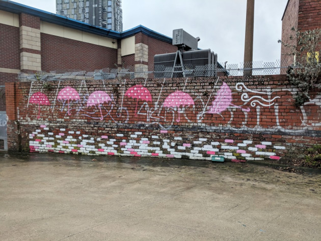 Umbrellas mural behind Theatre Deli